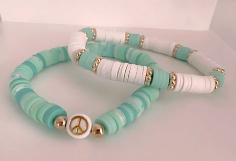 || This tropical teal bracelet set is the perfect edition for your wrist in the summer! || This set makes a great gift for any occasion! || || Details || - Handmade Item - Closure: Tie - Sizes: 6, 6.5, 7, 7.5, 8, 8.5 Inches || We recommend that you keep your bracelets dry due to the nature of the material || Bright Clay Bead Bracelets, Materials For Bracelet Making, Teal Clay Bead Bracelet, Clay Bead Bracelet Set, Bracelets Preppy, Bracelets Clay, Bracelets With Beads, Make Clay Beads, Teal Bracelet