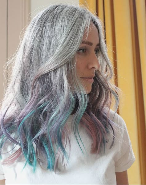 Blue Highlights In Grey Hair, Silver Hair With Blue Tips, Gray Hair With Blue Tips, Silver Blue Peekaboo Hair, Blue Roots Silver Hair, Blueish Silver Hair, Grey Hair With Purple Highlights, Grey Hair Tones, Purple Grey Hair