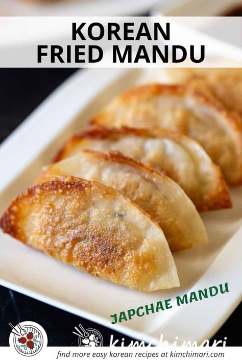 Yaki Mandu, Gun Mandu or Korean Fried Dumplings are light and crispy on the outside while soft and savory in flavor on the inside. They are filled with japchae noodles, veggies, tofu, kimchi, pork and beef and makes an awesome party appetizer or banchan. #koreanfood #potstickers #koreanrecipes #dumplings #koreancooking #mandu Yaki Mandu Recipe, Korean Mandu Recipe, Yaki Mandu, Mandu Recipe, Mandu Korean, Tofu Kimchi, Kimchi Pork, Japchae Noodles, Sweet Chili Sauce Recipe