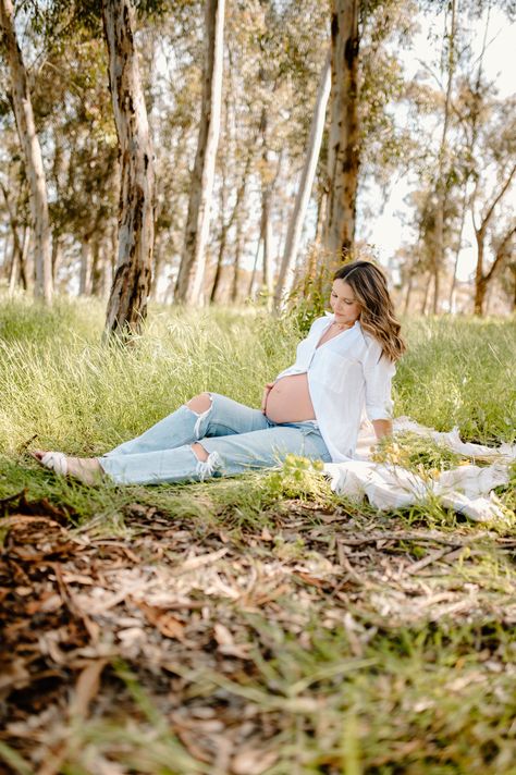 Mama poses in Eucalyptus trees with a white button up and jeans while showing off her cute baby bump Maternity Pictures White Button Up, Open Jeans Maternity Photos, Maternity Pictures Jeans White Shirt, Maternity Photo Shoot White Button Up, Maternity Photography Poses Mom Only, Maternity Pics With Jeans, Maternity Pics Jeans, Maternity Photography With Jeans, Blue Jean Maternity Pictures Photo Ideas