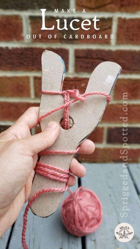 First person point of view of left hand holding two-tined lucet knitting tool made of cereal-box cardboard with partially completed cord wrapped around it. Tools For Knitting, Viking Weaving, Lucet Fork Projects, Lucet Projects, Viking Crafts For Kids, Viking Diy, Viking Crafts, Viking Knit Tutorial, Wild West Crafts