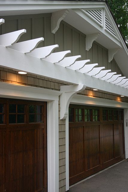 These rich looking wood doors are sure to be the envy of the neighborhood! Garage Door Trellis, Garage Arbor, Garage Trellis, Garage Door Trim, Door Pergola, Garage Pergola, Wooden Garage Doors, Garage Exterior, Carriage Doors