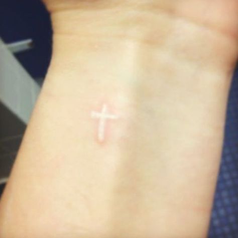 Small White Ink Cross Tattoo On Wrist Small White Ink Tattoo For Women, White Ink Cross Tattoo, Small White Tattoo For Women, Small Cross Tattoo On Wrist, Small White Ink Tattoo, Tiny White Ink Tattoo, Awesome Tattoos For Guys, White Cross Tattoo, White Ink Tattoo Ideas