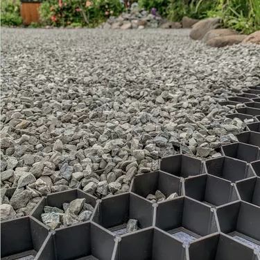 Diy Driveway, Gravel Landscaping, Asphalt Driveway, Glow Stones, Gravel Driveway, Driveway Landscaping, Solar Pathway Lights, Landscape Products, Flood Zone