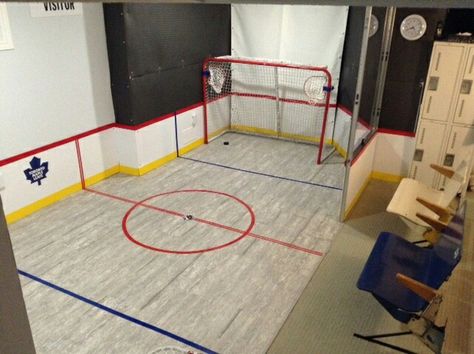 Hockey / Shooting / mini sticks area created for our daughter, in a finished basement. Minimal impact on finished portion,  easily restored to original finish for later use. Mini Sticks Hockey Room, Mini Hockey Stick Storage, Hockey Playroom, Hockey Garage, Finished Basement Storage, Basement Hockey, Hockey Basement, Craft Room Basement, Organize Playroom