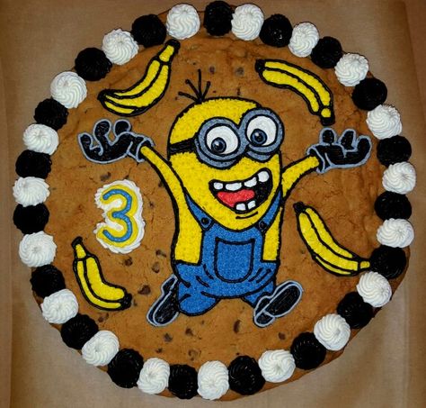 Minions Cookie Cake.  BANANAAAAA! Chocolate Chip Cookie Cake Decorated, Decorated Cookie Cake Birthday, Large Chocolate Chip Cookie Cake, Cookie Monster Sheet Cake, Minion Cookies, Minion Cookie Cake, Cookie Cake Designs, Giant Chocolate Chip Cookie, Giant Cookie