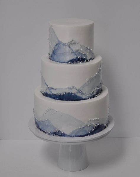 Winter Wedding Cake Blue, Blue White And Silver Birthday Cakes, White And Navy Wedding Cake, Ice Blue Wedding Cake, White Wedding Cake With Blue Flowers, Navy Blue Wedding Cake Ideas, Blue And Gray Wedding Cake, Silver And Blue Wedding Theme, Winter Wonderland Sweet 16 Cake