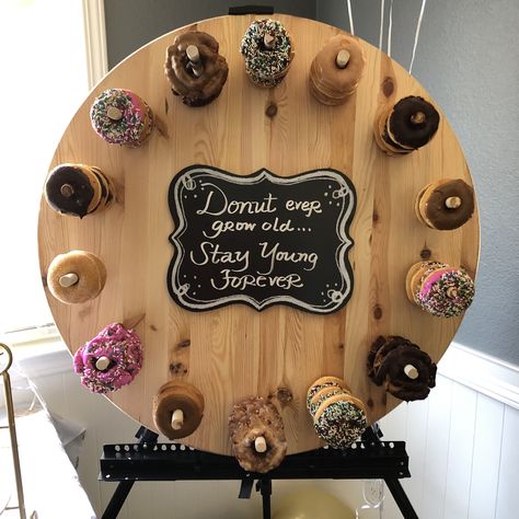 Donuts Display Ideas Parties, Donut Stand Ideas, Diy Donut Stand Dollar Stores, Charcuterie Board Wall Display, Donut Board Wedding, Charcuterie Board Wall, Donuts Display, Donut Themed Party, Donut Stands