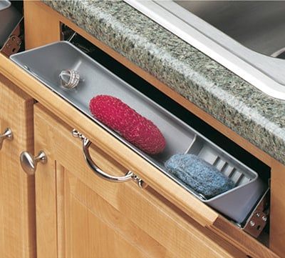 A sink tilt-out tray is used in place of false drawer fronts under a sink. The area is used to store small items, such as sponges, wash cloths, and hand soap. A sink tilt-out tray is a small storage area between the cabinet frame and the bowl of the sink. This area is usually wasted,... Kitchen Sink Shelf, Under Sink Drawer, Under Kitchen Sink, Kitchen Sink Cabinet, Under Kitchen Sink Organization, Kitchen Sponge Holder, Kitchen Sink Organization, Sink Shelf, Under Sink Storage