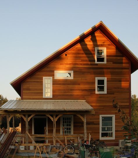 The view from the west reveals the shape of the saltbox roof. Saltbox Roof, Saltbox House Plans, Salt Box House, Saltbox Houses, Shed Building Plans, Porch Roof, Cedar Siding, Sunset Light, Passive Solar