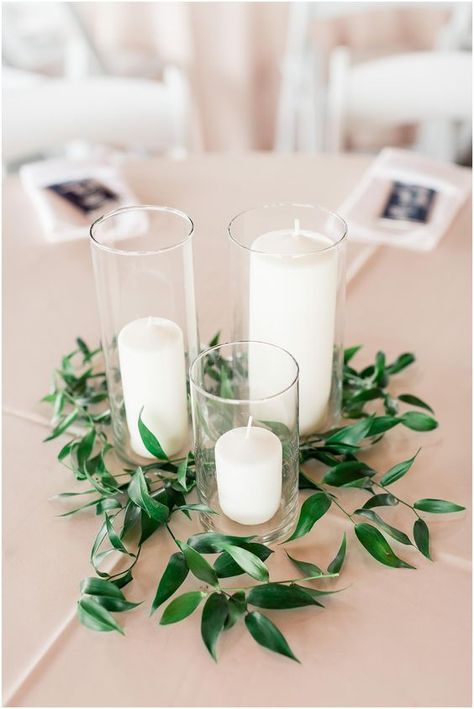 centerpiece idea, candles, greenery, italian ruscus Vineyard Wedding Reception, Green Wedding Centerpieces, Early Spring Wedding, Beautiful Wedding Centerpiece, Cheap Wedding Decorations, Simple Wedding Flowers, Wedding Motifs, Rustic Wedding Decorations, Simple Wedding Centerpieces