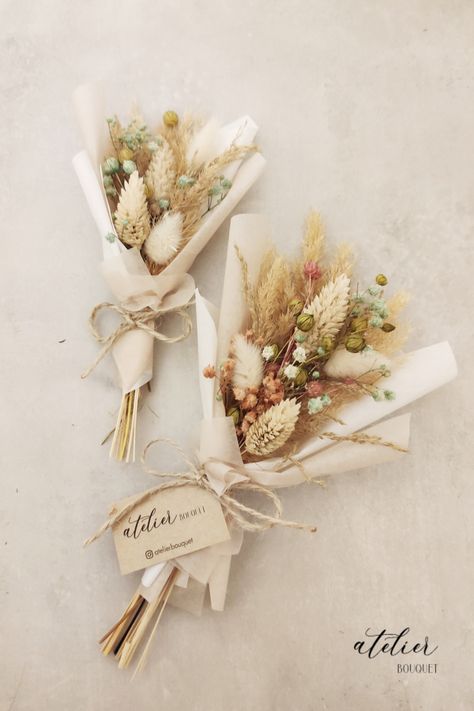 Surprise and delight your wedding guests with these charming dried mini bouquets, perfect for gifting as a heartfelt thank-you. One bouquet is slightly larger than the other and features delicate white and pink flowers. The other is a smaller version, perfect for holding and admiring up close. Each bouquet is made with attention to detail that matches your wedding colors. These timeless bouquets are sure to delight all of your guests, and serve as a cherished reminder of your special day." Single Dried Flower Bouquet, Dried Flower Wedding Favor, Mini Dried Flower Bouquet Diy, Small Dry Flower Bouquet, Dried Flowers Ideas Bouquet, Mini Dried Bouquet, Dried Flowers Bouquet Gift, Dried Flowers Gift Ideas, Dried Flower Boquet