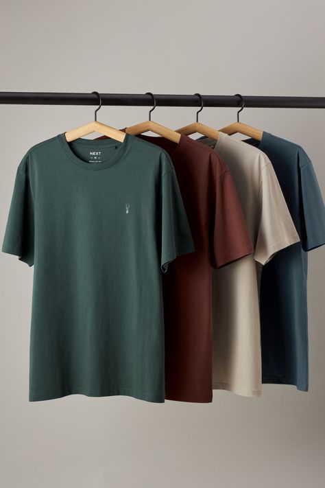 Refresh your essentials with this multipack of casual T-Shirts. With a classic crew neckline and short sleeves, they're finished with our signature stag at the chest. 4 x T-shirt 100% Cotton. Discover the must-have outfit clothing pieces for your wardrobe this season! This guide is packed with trendy picks that will elevate your style game. Don’t miss out on the hottest items that every fashion lover should own this year! 🌟 #fashion #style #outfitclothing #trend #wardrobeessentials Tshirt Hanging Ideas, Best T Shirts Men, Best T Shirt For Men, Aesthetic T Shirts Men, T Shirt Brand Photoshoot, Cloth Photoshoot Ideas, New T Shirt Designs For Men, Mens T-shirt, T Shirt Shoot Ideas