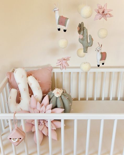 Available to order again 😍! Elevate your #nurserydecor with our lovingly #handcrafted Pom Pom Paradise Nursery Mobile & matching decor pillows. This charming mobile features an enchanting mix of adorable llamas, elegant ivory pom poms, lush pastel pink succulents and #sagegreen cacti, creating a delightful and serene environment for your little one. Share with your friends today 🥰 #shopsmall #nurseryinspo Llama Nursery Theme, Llama Themed Nursery, Pink Succulents, Llama Nursery, Serene Environment, Baby Room Inspiration, Nursery Theme, Nursery Inspo, Decor Pillows