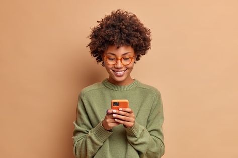 Free Photo | Vertical shot of happy young woman with curly hair holds notepad and pen makes notes what she observes around in city dressed in casual green jumper poses outdoors against blurred background Notepad And Pen, Woman With Curly Hair, Green Jumper, Green Jumpers, Brunette Woman, Job Work, City Dress, Business Money, Free Photo