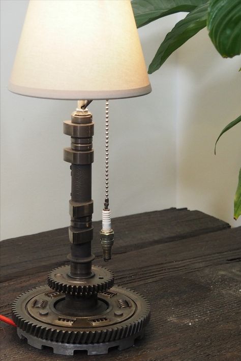 Industrial lamp handcrafted from upcycled motorcycle parts, by Lacour Motorcycles Car Parts Lamp, Motor Parts Shop Design, Motorcycle Decor Interior Design, Car Part Lamp, Motorcycle Bedroom, Man Cave Lighting, Old Car Parts, Lampe Metal, Car Parts Decor