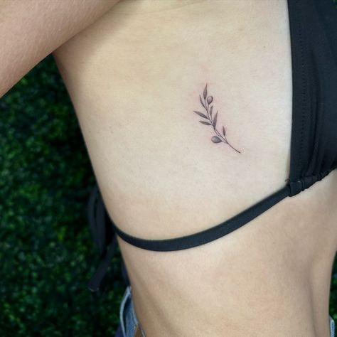 Little olive tree branch 🫒 her first tattoo! For appointments please fill out the booking form on www.kattitudetattoo.com . . . #atx#atxlife#austin#austintexas#atxtattoosaustin#atxtattooaustin#tattooatx#tattoosatx#singleneedletattooaustin#singleneedletattoosaustin##smalltattoosaustin#smalltattooaustin#smalltattooatx#smalltattoosatx#flowertattoosaustin#flowertattooaustin#flowertattoosatx#finelinetattooatx#finelinetattoosatx#finelinetattooaustin#finelinetattoosaustin#stickertattoosaustin#st... Olive Flower Tattoo, Olive Tattoo Design, Dove Olive Branch Tattoo, Olive Tree Branch Tattoo, Small Olive Branch Tattoo, Fine Line Olive Branch Tattoo, Tattoos Mum, Dove With Olive Branch Tattoo, Olive Branch Sketch