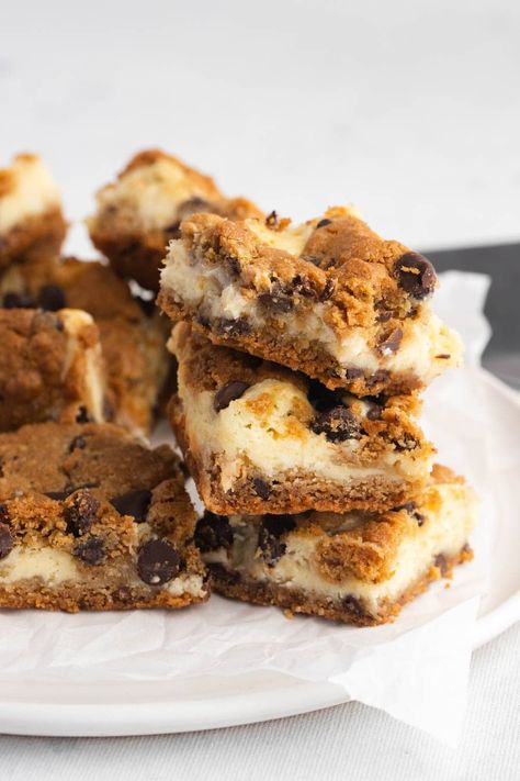 Treat yourself with these incredible chocolate chip cheesecake bars! With a cookie crust and a cheesecake topping, they're the best of both worlds. Cheesecake Cookie Bars, Cheesecake Topping, Chocolate Chip Cheesecake Bars, Cheesecake Cookie, Cheesecake Toppings, Chocolate Chip Cheesecake, How To Make Cheesecake, Chocolate Chip Cookie Bars, Cheesecake Cookies