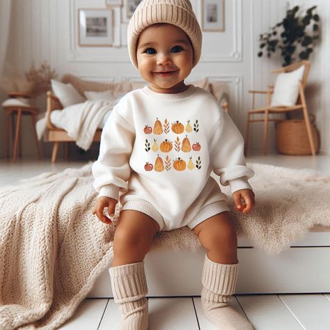 Add a little bit of Autumn cheer to your little's wardrobe with this sweet romper, the perfect Thanksgiving baby's outfit. This product is printed on a 100% cotton baby sweatshirt romper with buttons for easy changing time. This sweatshirt is a sturdy material, a wonderful quality heirloom to remember your babe's first thanksgiving. Fits oversized. This product is handprinted using nontoxic, water-based inks & heat pressed on a cozy 100% cotton fabric. Easy button-ups for changing time! This ite Fall Newborn Outfits, Thanksgiving Fits, Fall Photo Outfits, Fall Baby Announcement, Thanksgiving Baby Outfits, Romper Fall, Sweatshirt Romper, Pumpkin Outfit, Fall Baby Clothes