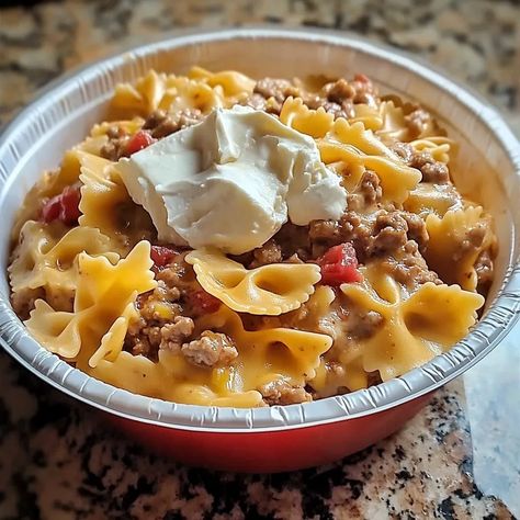 A culinary masterpiece! You simply must give this a go!Combine 1 large piece of Velveeta cheese, 1 block of cream cheese, 1 can of cream of chicken soup, 1 can of spicy Rotel Tomatoes, 2.25 pounds of ground beef, and 1 package of bowtie pasta.Cook the ground beef in a pan and add it to Rotel Pasta Ground Beef, Cream Cheese Recipes Dinner, Rotel Pasta, Bacon Cheeseburger Meatloaf, Beef Tips And Noodles, Velveeta Recipes, Cheeseburger Meatloaf, Baked Meatloaf, Cream Cheese Pasta