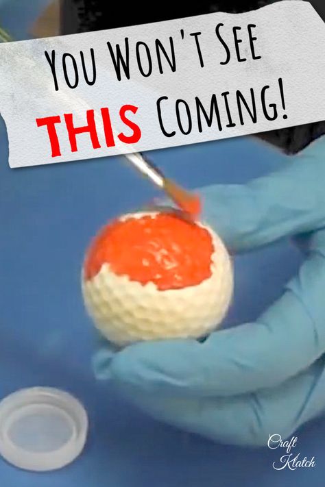 white golf ball being pained orange with a paint brush Upcycle Golf Balls, Golf Ball Decor, Crafts With Golf Balls, Golf Balls Crafts Ideas, Golf Diy Crafts, Golf Tee Crafts, Painted Golf Balls, Golfball Crafts, Golf Diy Projects