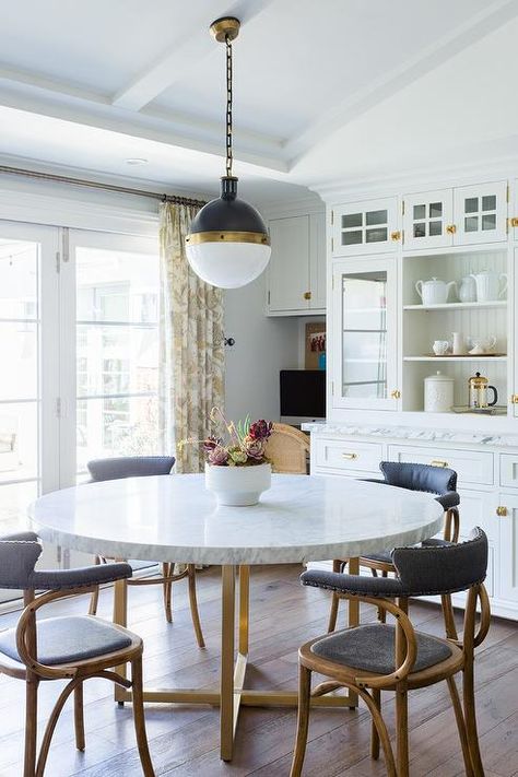 Vintage black leather and wood dining chairs sits around a round marble and brass dining table placed beneath a Hicks Pendant. Brass Dining Table, Vintage Dining Table, Dining Room Chairs Modern, Marble Dining, Dining Table Marble, Dining Table Design, Wood Dining Chairs, Room Remodeling, Marble Table