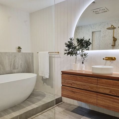 Modern bathroom featuring wall hung timber vanity, freestanding bath and plants for bathroom decor. #HomeDecor #Vanity  📷: @maddenbuilderstasmania Panelled Bathroom, Wood Benchtop, Plants For Bathroom, Timber Bathroom Vanities, Elegant Bathroom Design, Modern Bathroom Ideas, Timber Vanity, Custom Bathroom Vanity, Timber Walls