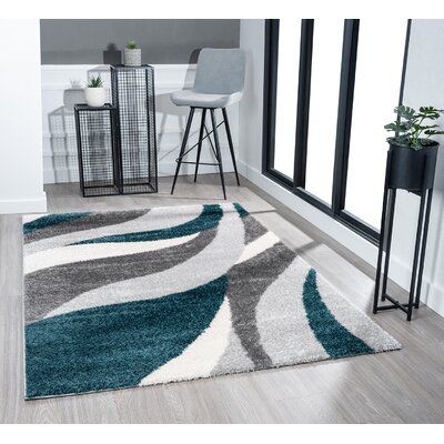 Incredibly soft, super vivid colours, this shag area rug will complete your decor | Ivy Bronx Flynn Geometric Teal Area Rug Brown/gray 63.0 x 1.5 in, Polyester | C004853418 | Wayfair Canada Teal Rugs In Living Room, Teal Area Rugs In Living Room, Teal And Grey Living Room, Teal Grey Living Room, Dark Grey Couches, Teal Decor, Black White Rug, Area Rug Brown, Teal Accents