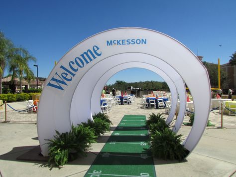 Spandex Arch Entrance into sports themed event with football field carpet runner and custom vinyl  #FLeventdecor Football Event Design, Gate Event Design, Padel Tournament, Event Stage Design Ideas, Entrance Arch Design, Event Entrance Design, Event Entrance Arch Design, Event Entrance Arch, Arch Entrance