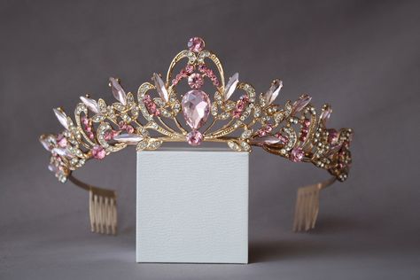 A small and delicate pink crown. The crown is perfect for both children and adults due to its small size and weight. Beautiful sparkling tiara with pink crystals in gold or silver plated. Incredible tiara that will look great on the bride. I'm sure you will get a lot of compliments.  Height of the tiara - 2"( 5 см) Features: Tiara made with pink crystals and rhinestones Sturdy metal frame Delicate crystal pattern Care instructions: Avoid contact with water Clean with a soft cloth Store in a cool Princess Tiaras, Crystal Wedding Crown, Pink Tiara, Wedding Tiara Veil, Tiara Silver, Crystal Crown Wedding, Crown Birthday, Birthday Tiara, Crown Crystal