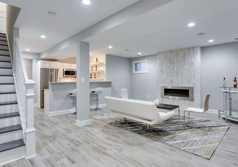 Modern basement living room with small kitchen porcelain tile floor and white furniture with fireplace Gray Basement, Basement Colors, Basement Paint Colors, Basement Painting, Bar In Casa, Modern Basement, Basement Inspiration, Basement Living Rooms, Diy Basement