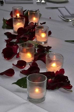 very simple way to decorate long tables. Candle And Petals Centerpiece, Rose Petals And Candles Centerpiece, Simple Red Rose Centerpiece, Rose Petals On Table, Rose Petals Wedding Table, Rose Petals Table Decor, 15 Decorations, Tiana Wedding, Rose Centerpieces Wedding