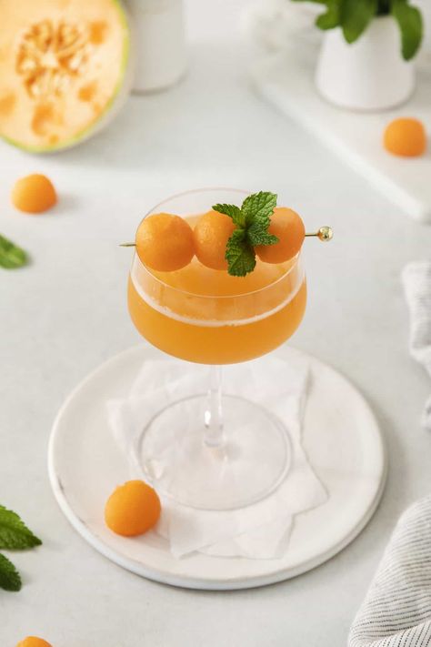 These Cantaloupe Ginger Cocktails are the perfect drink for summer. They're light, refreshing, and loaded with the best flavors using fresh cantaloupe, ginger, lime, and mint. Cantaloupe Cocktail, Drink For Summer, Ginger Cocktails, Lexi's Clean Kitchen, Ginger Drink, Cocktail Garnish, Candied Ginger, Ginger And Honey, Clean Kitchen