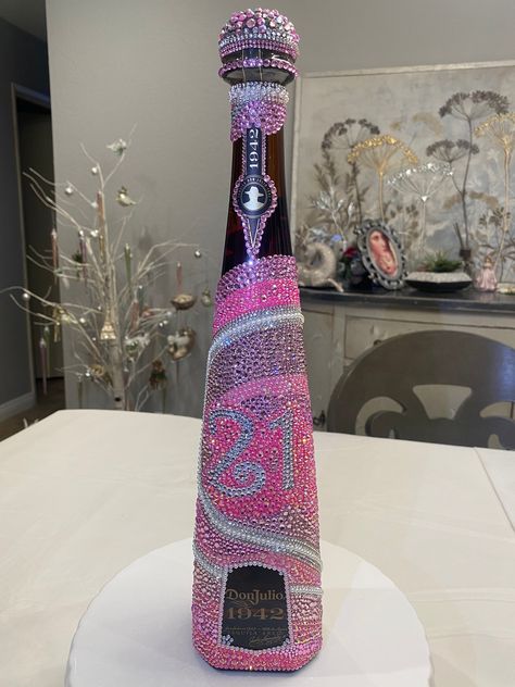 At Karine's Krystals, I am able to customize any alcoholic bottles to meet your specific desires and preferences. Whether it's a centerpiece for your most elegant gatherings or a cherished gift for those who appreciate the finer things in life, our bedazzled alcoholic bottle stands as a symbol of refined taste and unparalleled luxury. Bedazzled Alcohol Bottle, Custom Alcohol Bottles, Bedazzled Bottle Titos, Don Julio 1942 Bottle Decorated, Bedazzled 1942 Bottle, Bedazzled Flask, Bedazzled 818 Bottle, Bling Dusse Bottle, Bedazzled Bottles