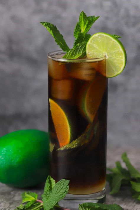 Elevate your cocktail game with this refreshing and delicious Black Mojito recipe! Made with diabetic-friendly ingredients and natural sweeteners, this low-carb cocktail is the perfect guilt-free indulgence. The combination of fresh mint, tangy lime, and dark rum creates a unique and bold flavor that's sure to impress. Whether you're hosting a party or simply looking to unwind, this mojito is a must-try. Discover more delicious low-carb and diabetic-friendly recipes on our blog! Black Mojito, Sugar Free Cocktails, Low Carb Cocktails, Low Calorie Drinks, Mojito Cocktail, Slice Of Lime, Mojito Recipe, Dark Rum, Fresh Mint Leaves