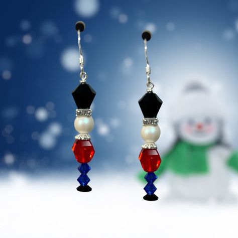 Limited Edition DIY Jewelry Kit - Nutcracker Earring by Toocutebeads.com Ignite your festive spirit with our Nutcracker Earring DIY Jewelry Making Kit. This limited-edition kit allows you to create your own unique pair of Christmas earrings, combining vintage Swarovski crystals with sterling silver. The result? A captivating pair of earrings that embody the joy and charm of the holiday season. Key Features & Benefits: Limited Edition: As part of a unique, limited edition series, this kit provide Christmas Nutcracker Earrings, Beaded Snowman Earrings Diy, Nutcracker Beaded Earrings, Christmas Charm Earrings, Christmas Diy Jewelry Ideas, Xmas Earrings Diy, Christmas Earing Diy, Diy Christmas Earrings Easy, Beaded Jewelry Christmas