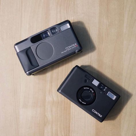 If you had to pick the best compact camera one could buy if money is no object the odds are either the Contax T2 or T3 would be at the top of many peoples list. This enviable duo belong to @vonnlayug and are making me think seriously about giving the T2 another try.  #cameracult #contax #contaxt2 #contaxt3 #35mmfilm #compactcamera #pointandshoot #analogphotography #cameraporn #pointandshoot #filmcamera #analog #shootfilm #filmisnotdead Digital Camera For Beginners, Contax T2, Sony Digital Camera, Film Camera Photography, Camera Collection, Best Digital Camera, Camera Aesthetic, Film Photography Tips, Hollywood Film