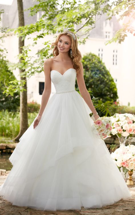 This layered ball gown wedding dress from Stella York is a princess bride's dream come true! Layers of frothy tulle create volume through asymmetrical horsehair hemlines. A lace covered bodice with a strapless sweetheart neckline is reminiscent of traditional ball gowns but this wedding gown is given an update with a Diamante belt that shimmers at the waist. This lovely gown is also available in plus sizes. Boho Wedding Dress With Sleeves, Rock Dress, Stella York Wedding Dress, The Princess Bride, Princess Bridal Gown, Stella York, Princess Wedding Dress, Wedding Dresses Strapless, Wedding Gowns Lace