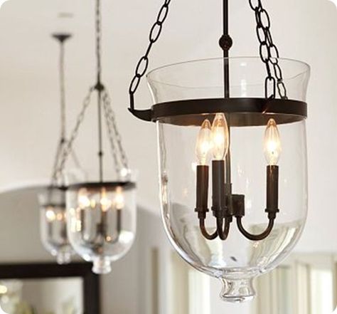 Seven years after receiving a glass candle holder from a friend, Jen from Jenspire: Simply Inspiring paired it with pieces from a Craigslist chandy to create a gorgeous lantern chandelier. Jen says, “I simply took apart the old chandelier, spray painted it dark brown, and    attached to the candle holder using inexpensive chain and S hooks purchased from Lowe’s. The whole DIY project took just a few hours and saved me over $275!” It’s pretty amazing how closely Jen’s candle holder mimics the sha Ceiling Lamp Dining Room, Industrial Hanging Lights, Metal Living Room, Dining Room Industrial, Dining Room Ceiling, Pendant Light Styles, Kitchen Lights, Metal Pendant Light, Kitchen Lighting Fixtures