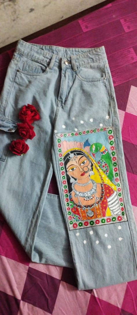 "Bringing the colors of Madhubani to denim dreams 🎨✨ Combo of #trending with #traditional Get your #favorite #denims painted as you wish to give them a #new #unique look. Contact us 8780038987 #sajdawithchandni #painting #art #commission #happycustomer"#handmadewithlove #MadhubaniPainting #DenimLove #ArtisticFlair" Madhubani Painting In Kurti, Fabric Painting Designs For Kurtis Unique, Madhubani Paintings Traditional, Traditional Madhubani Art, Long Sleeve Blouse Designs, Suit Painting, Mithila Art, Painting Clothes, Cloth Painting