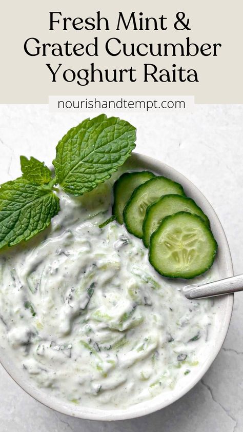 A bowl of raita topped with cucumber slices and a fresh mint sprig Indian Cucumber Raita, Cucumber Raita Recipe Indian, Raita Recipe Indian, Cucumber Raita Recipe, Healthy Dressings, Mint Raita, Raita Recipe, Yoghurt Dip, Cucumber Raita