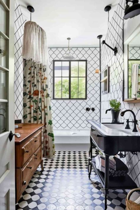 15 Amazing Black And White Farmhouse Bathroom Decor Ideas - Hey Decor Girl [Latest Trending Decor Design Ideas] Black And White Farmhouse Bathroom Decor, Black Bathroom With Gold Accents, Black And White Bathroom With Color Pop, Black And White Tile Bathroom Vintage, Black And White Farmhouse Bathroom, Bathroom With Black Accents, Mixing Modern And Farmhouse, White Farmhouse Bathroom, Black And White Bathroom Floor