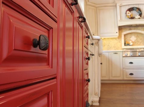 Red kitchen cabinets with oil-rubbed bronze drawer knobs make for a lively country kitchen.  Red like this for my kitchen island. Red Kitchen Cabinets Rustic, Kitchen Cabinets Rustic, Red Kitchen Cabinets, Dining Chairs Diy, Farmhouse Bench Diy, Room Improvement, Red Cabinets, Cheap Bathroom Remodel, Farmhouse Cabinets