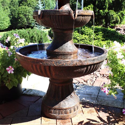 Brown oudoor tiered electric water fountain with flower blossom top Features fiberglass and resin construction Includes 3-tier fountain, electric submersible pump Cover or store before freezing weather occurs Dimensions: 25" diameter x 43" H; 40 lbs Add elegance and charm to any outdoor space with this tiered electric water fountain. Whether placed in a garden, on a deck, patio, or porch the ample size and beauty of this piece will be sure to make a statement. As a bonus, the soothing sounds of Fountain Centerpiece, Outdoor Electrical Outlet, Resin Water, Bird Bath Fountain, Fiberglass Resin, Waterfalls Backyard, Fountain Feature, Waterfall Features, Water Fountains Outdoor