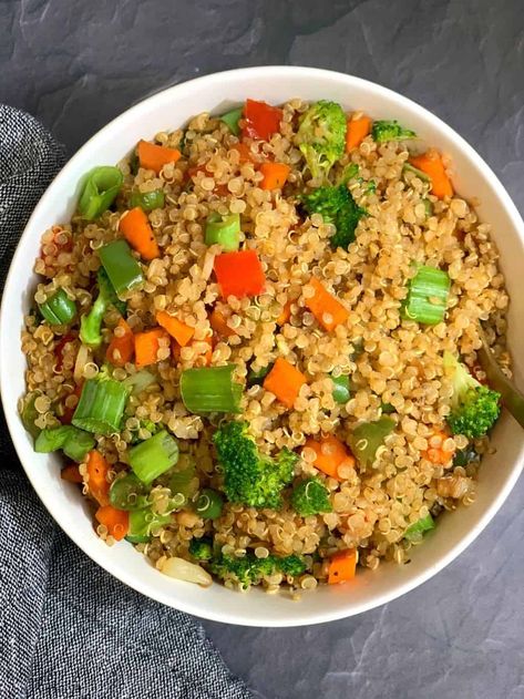 Vegetable Quinoa Fried Rice recipe is a easy ,healthy and delicious Indian Chinese style stir fried dish that can be prepared with leftover quinoa in just 20 minutes and makes a great weeknight or lunchbox meal that everyone will love. Vegan and kid approved! Indian Quinoa, Quinoa Fried Rice Recipe, Keto Indian Food, Healthy Quinoa Recipes, Leftover Quinoa, Quinoa Fried Rice, Sleeve Recipes, Indian Vegan, Quinoa Recipes Healthy