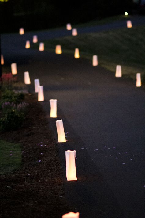 fill white paper bags with sand and one tea candle and let it light your way! Navy Suit Green Tie, Paper Bag Candles, White Glow Sticks, Luminaries Paper Bag, Bridesmaid Dresses Emerald Green, Candle Path, Bridesmaid Dresses Emerald, Rapunzel Quince, Paper Bag Lanterns