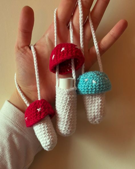 These crocheted mushroom lip balm holders were such a fun commission project and are such a great gift idea! They were so quick and easy to whip up too! Maybe I’ll do a tutorial? 👀 . . . #crochetmushroom #mushroomcrochet #crochetaccessories #lipglossholder #lipbalmholder Crochet Lip Balm Holder Pattern Free, Lip Balm Keychain Diy, Crochet Lipstick Holder, Mushroom Lip Balm Holder, Crochet Lighter Holder, Crochet Lip Balm Holder, Crochet Lip Balm, Crocheted Mushroom, Crochet Mushroom