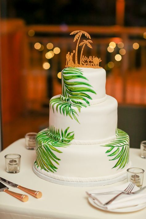 Tropical Inspired Smooth White with Painted Green Palm Leaves Wedding Cake with Custom Gold Cake Topper | Tampa Bay Wedding Photographer Lifelong Photography Studios Palm Leaf Wedding Cake, Palm Tree Wedding Cake, Jungle Wedding Cake, Palm Leaves Cake, Leaves Wedding Cake, Tropical Cakes, Tiki Cake, Palm Leaves Wedding, Wedding Cake Theme