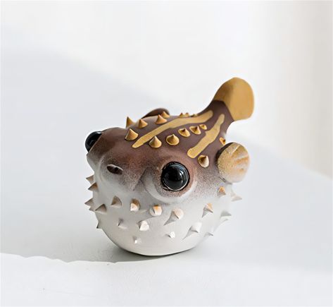 PRICES MAY VARY. 【Exquisite Craftsmanship】✨ This tea pet is made using traditional Yixing Zisha craftsmanship. Every detail is meticulously carved, showcasing the three-dimensional and vivid appearance of the pufferfish. 【Unique Design】🐡 Featuring a pufferfish design, this tea pet is charming and whimsical. The pufferfish symbolizes wealth and good luck, making it a delightful addition to your tea table and a harbinger of good fortune. 【High-Quality Material】🏺 Made from premium Yixing Zisha cl Small Animal Sculptures, Clay Pinch Pot Ideas Animals, Pinch Ceramics Ideas, Fishbowl Decor, Ceramic Animals Sculpture, Clay Sea Creatures, Cute Clay Creations, Clay Rattles, Whimsical Ceramics