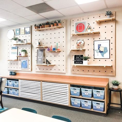 Megan Rowe on Instagram: “These pegboard shelves are one of the most asked about things in my classroom.  My husband built these for me, and they were definitely a…” Classroom Wall Shelves, Peg Board Ideas Classroom, Peg Board Classroom, Peg Board Classroom Ideas, Classroom Pegboard Ideas, Teacher Pegboard, Classroom Shelving Ideas, Pegboard Classroom, Classroom Cabinet Decor